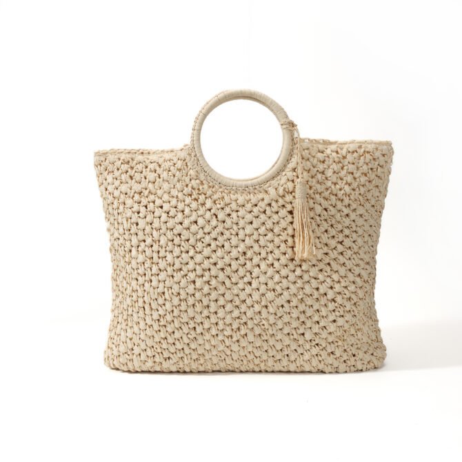 Beige woven beach tote bag with round handles
