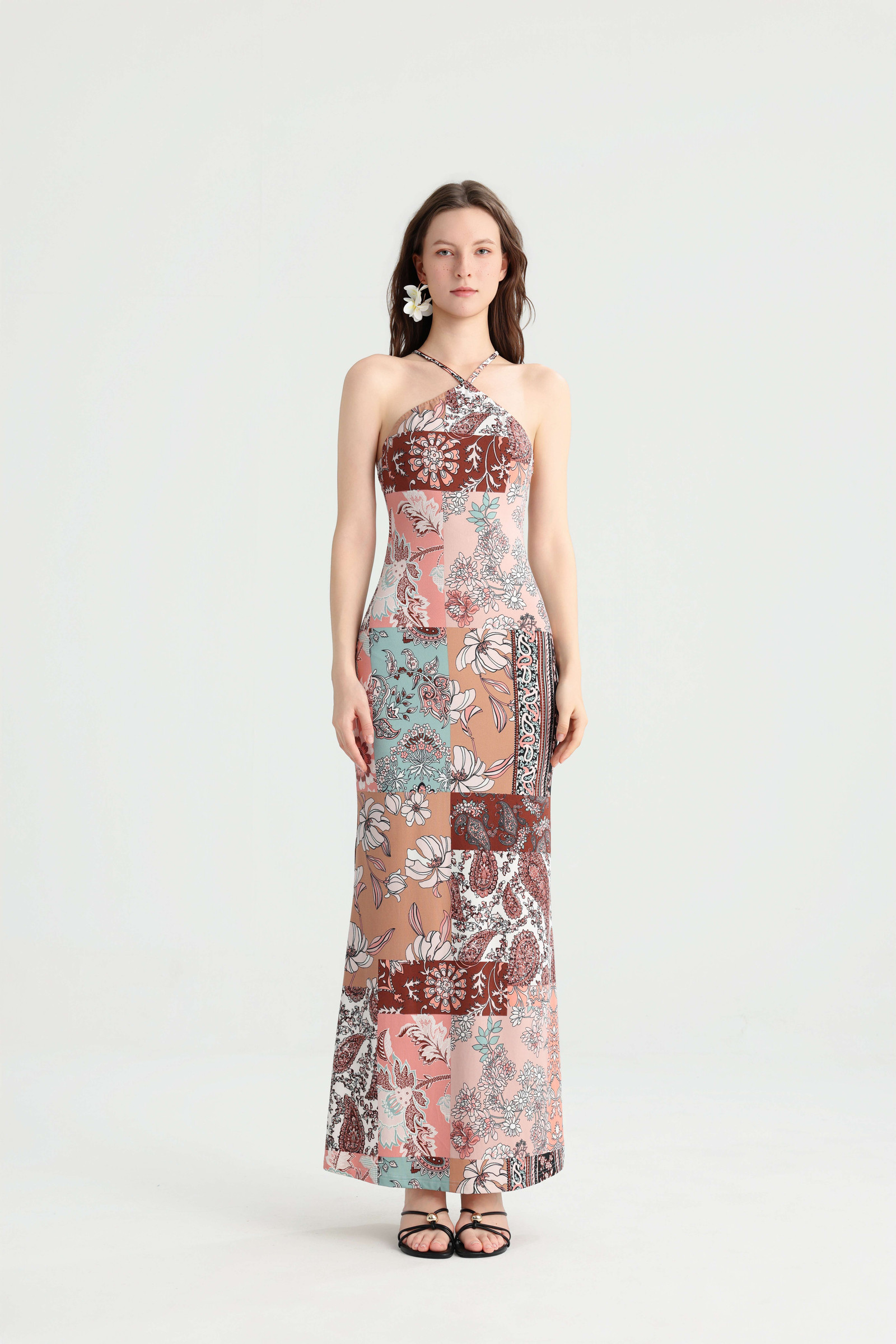 Full-length front view of the patchwork maxi dress showing the crossover halter neckline