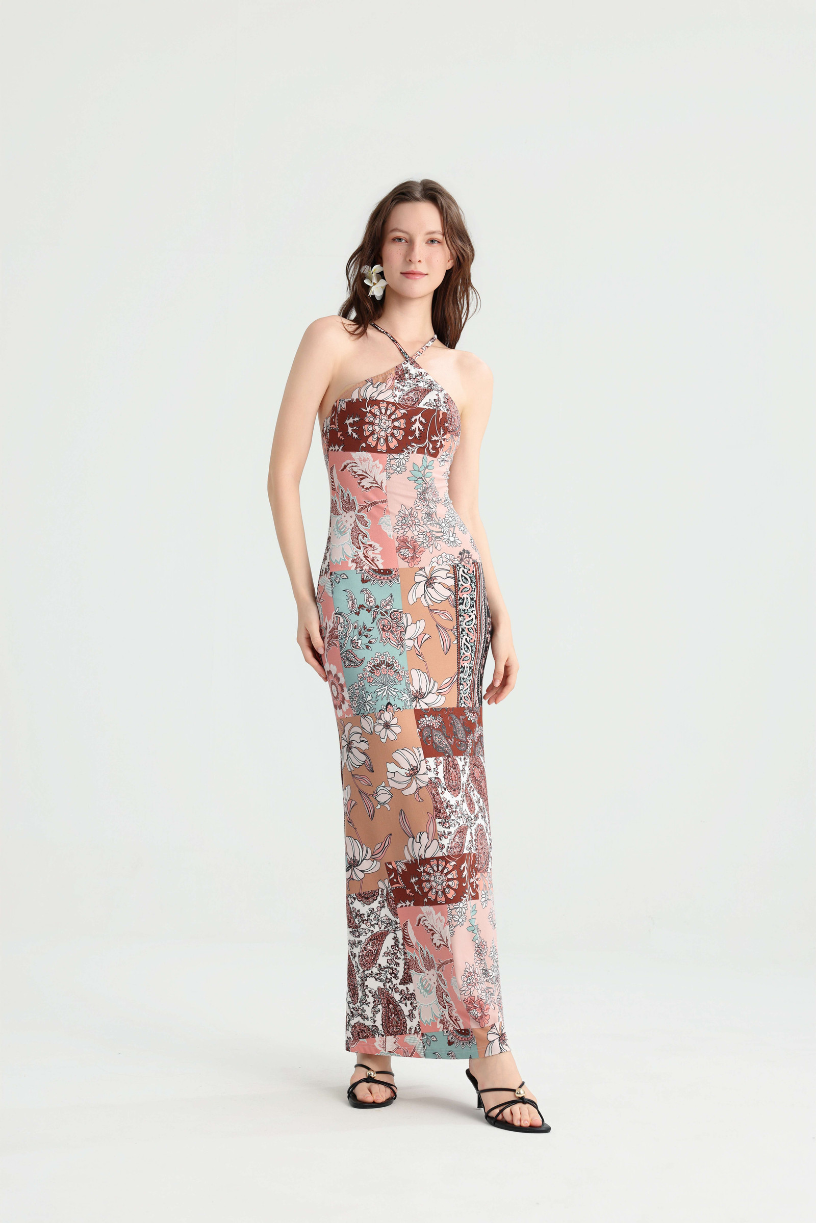 Front view of the pink and blue patchwork maxi dress styled with black strappy sandals
